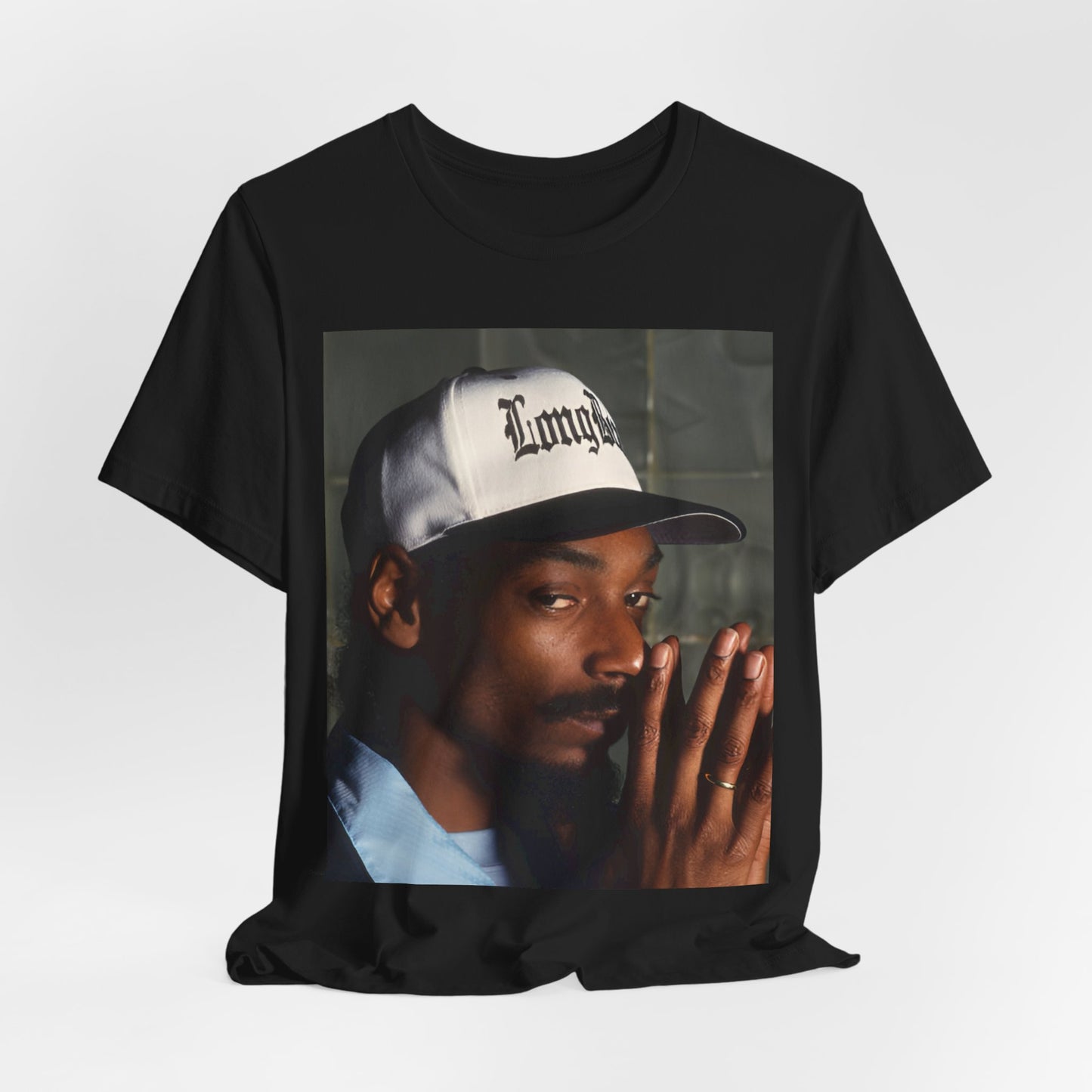 A black graphic t-shirt featuring a graphic of Snoop Dogg with a boxy 'Doggfather' vibe.