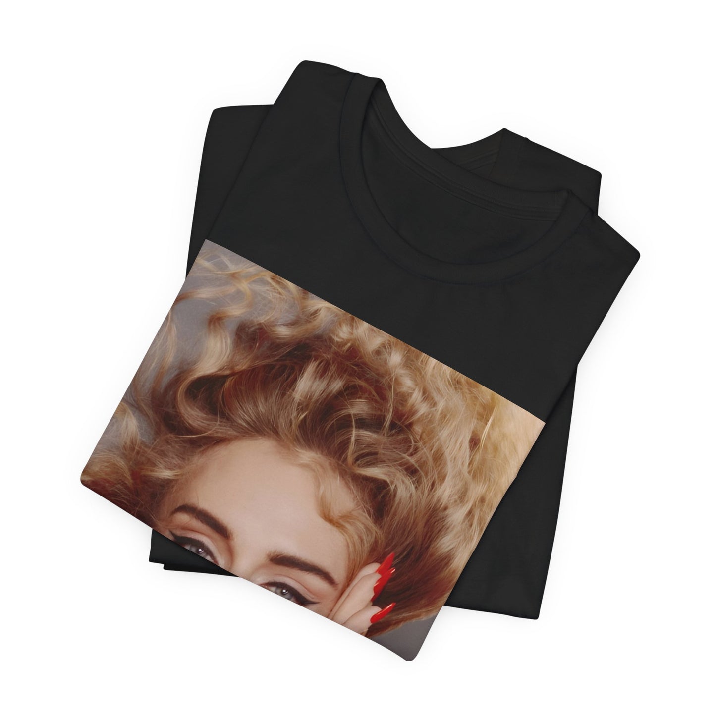 A black graphic t-shirt featuring a detailed, artistic black and white portrait of Adele with her hair dramatically caught in a breeze around her face and her hands gently placed on her cheeks.