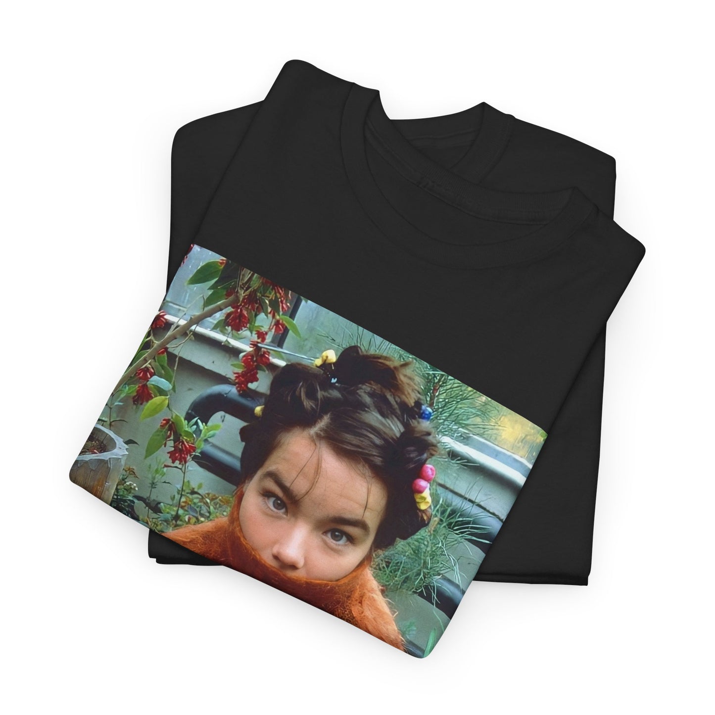 A black graphic t-shirt featuring a dynamic and 'fierce' graphic of Bjork, emphasizing her strong and confident presence.
