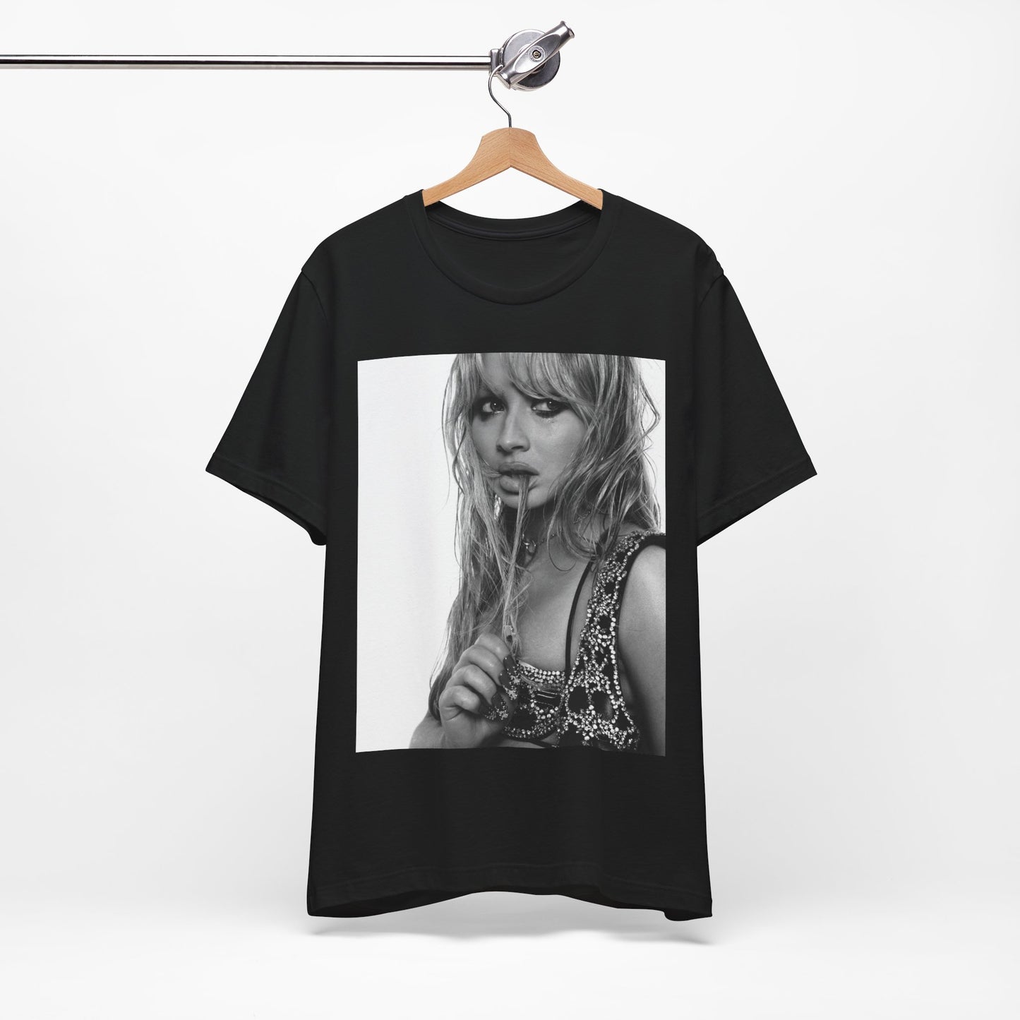 A black graphic t-shirt featuring a black and white portrait photo of Sabrina Carpenter.
