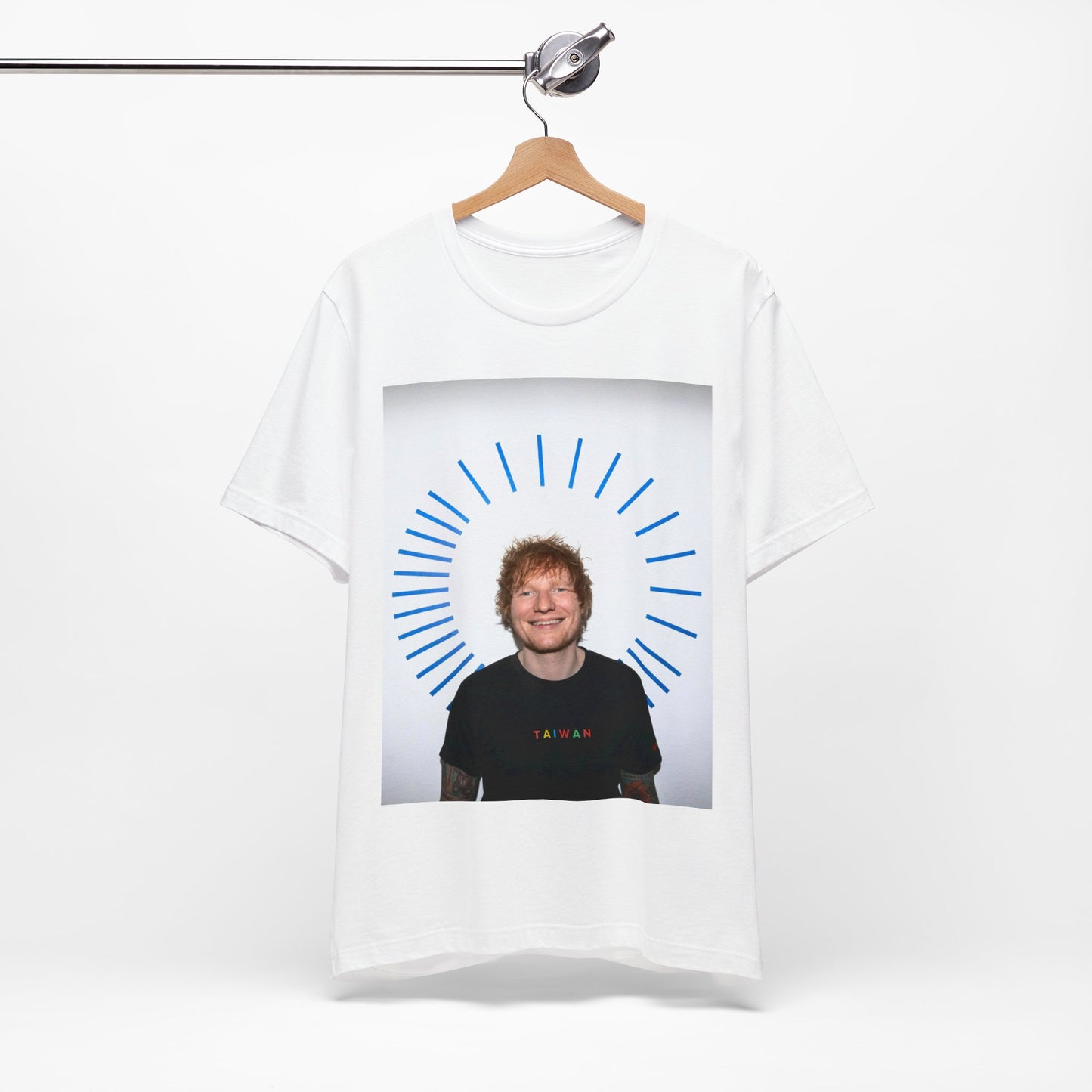 A black graphic t-shirt featuring a classic photo portrait of Ed Sheeran in a folk-pop style.