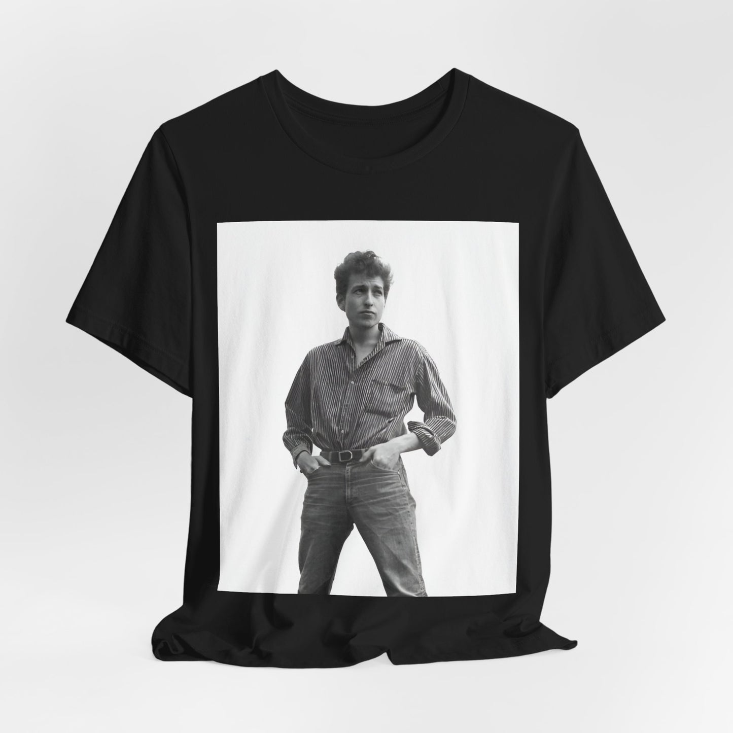 A black graphic t-shirt featuring a vintage 60s folk aesthetic graphic of Bob Dylan.