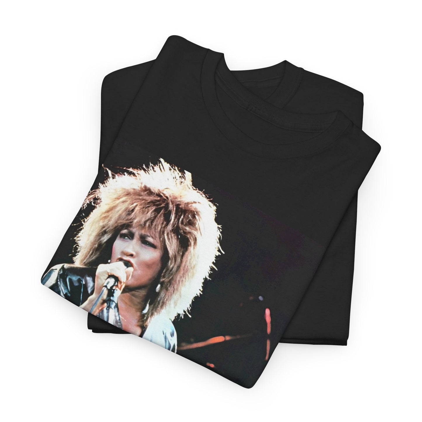 A black graphic t-shirt featuring a 90s graphic or photo of Tina Turner performing live on stage.