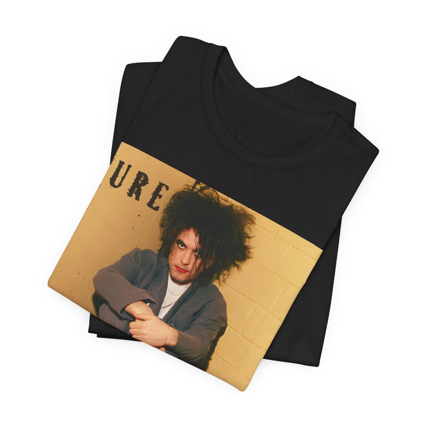 A black graphic t-shirt featuring a bold goth rock superstar graphic of The Cure.