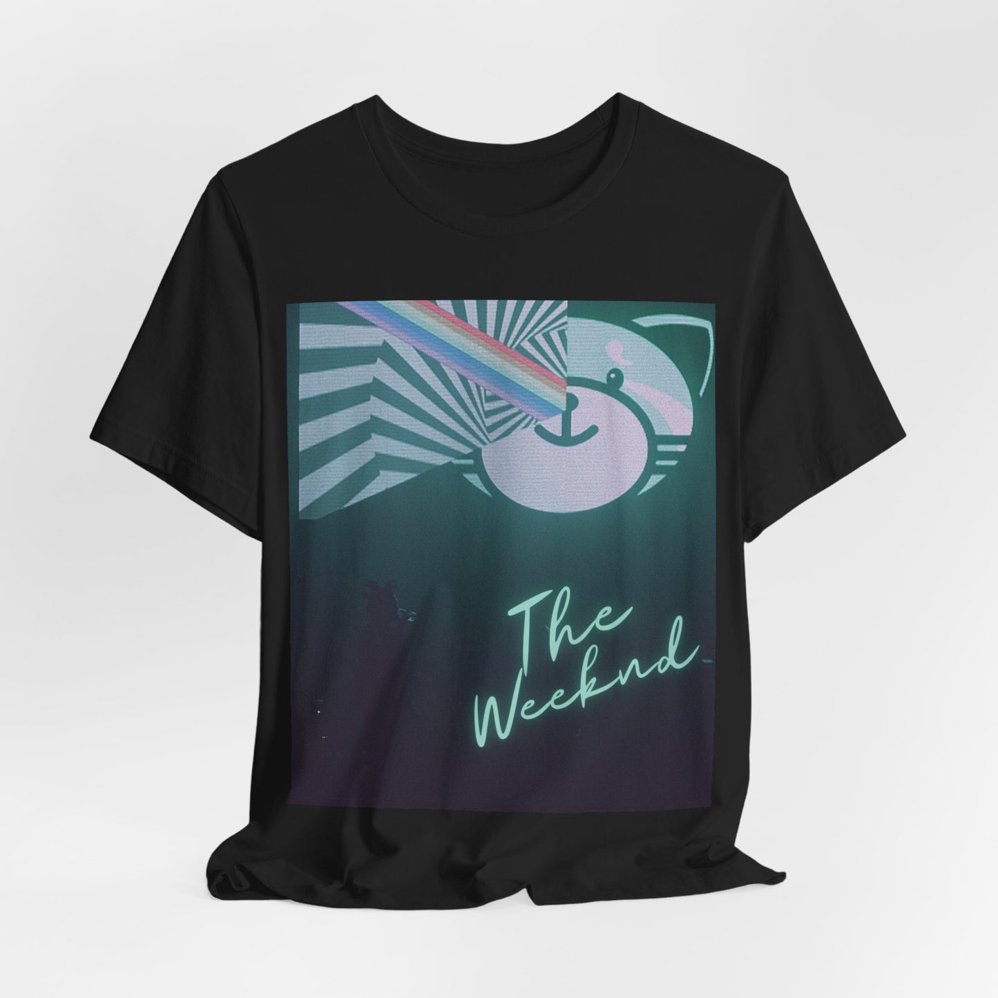 A black graphic t-shirt featuring a vintage concert graphic of The Weeknd from his 'Kiss Land' era.