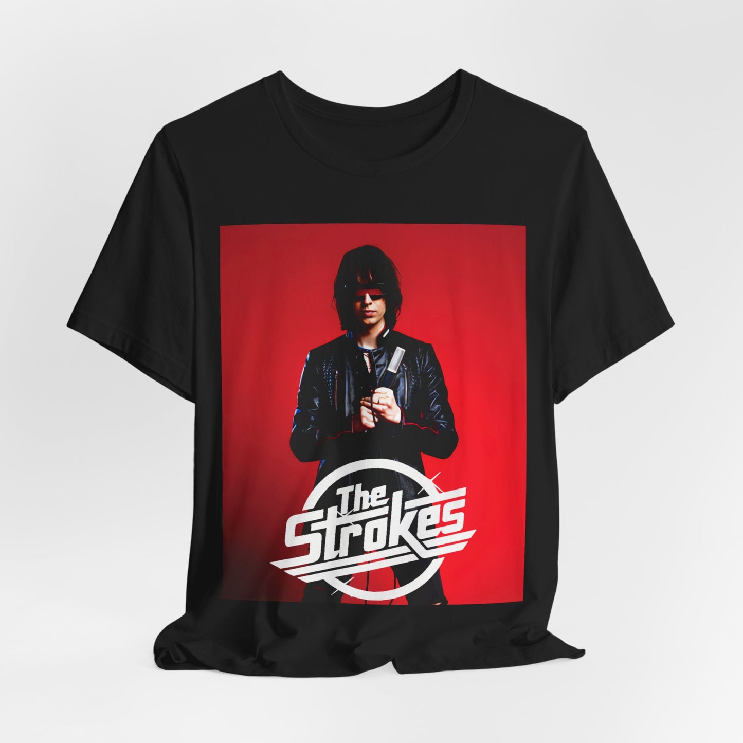 A black graphic t-shirt featuring a bold indie rock superstar graphic of The Strokes.
