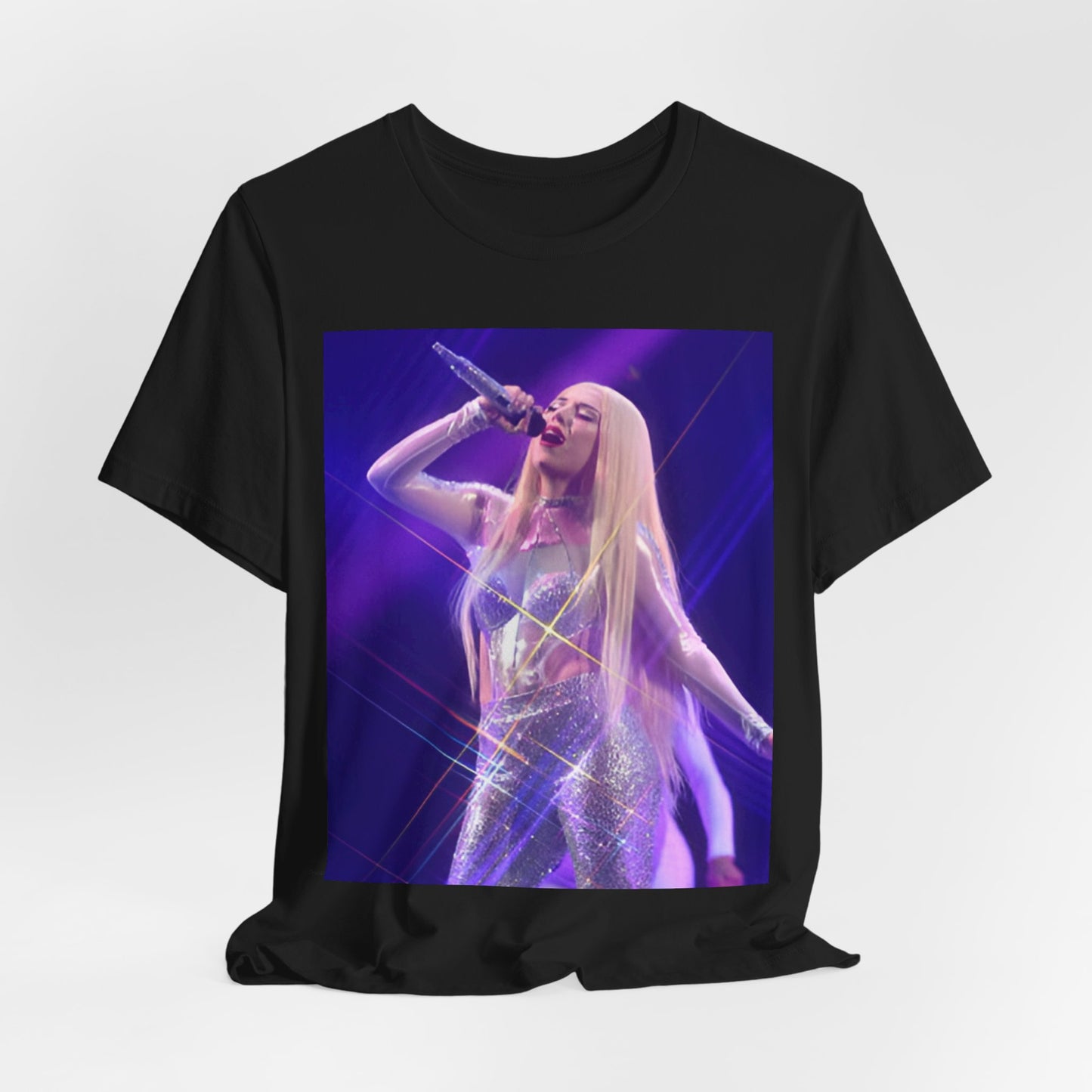 A black graphic t-shirt featuring a photo or illustration of Ava Max performing on stage, with a glittering or sparkling effect.