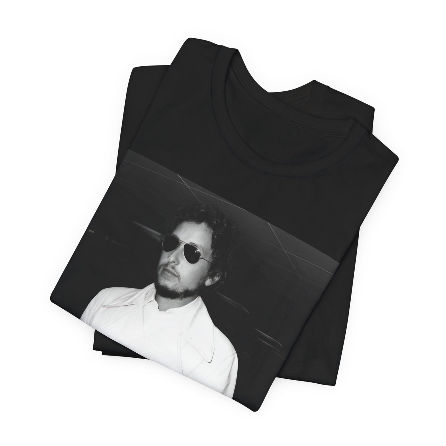 A black graphic t-shirt featuring a vintage black and white photo of Bob Dylan in a contemplative or iconic pose.