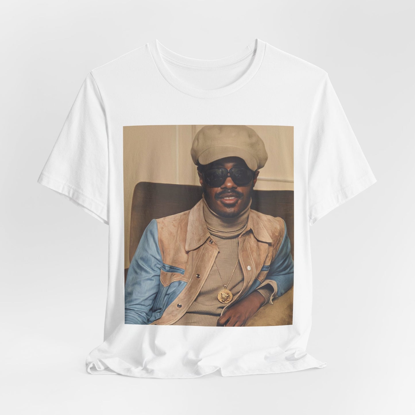 A black graphic t-shirt featuring a retro graphic related to Stevie Wonder's 'Songs in the Key of Life' album era.