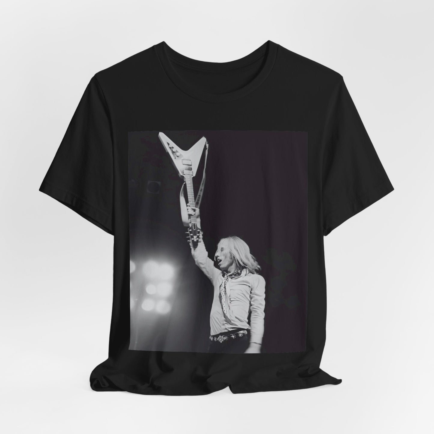 A black graphic t-shirt featuring a graphic or photo of Tom Petty playing guitar on stage.
