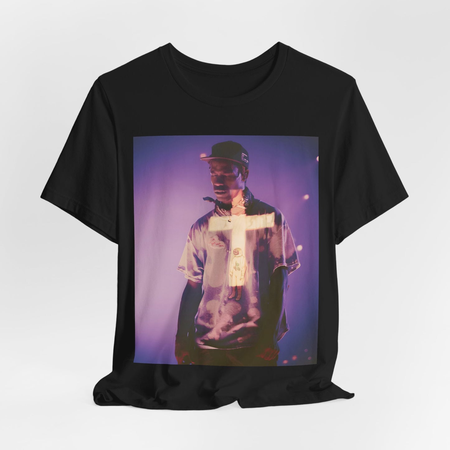 A black graphic t-shirt featuring a graphic of Travis Scott with dark fantasy vibes.