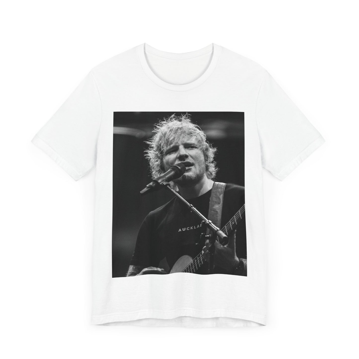 A black graphic t-shirt featuring a black and white photo of Ed Sheeran performing live.