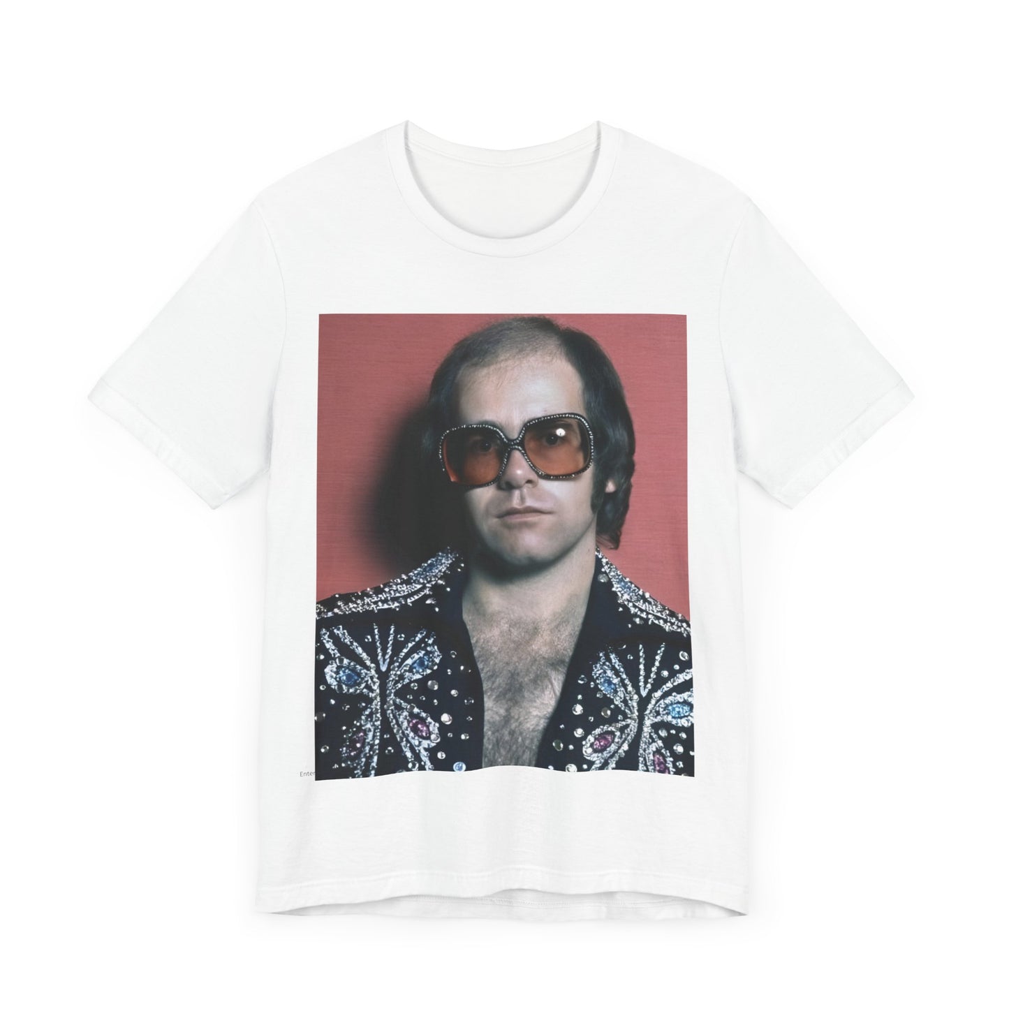 A black graphic t-shirt featuring a vintage glam rock icon graphic of Elton John.