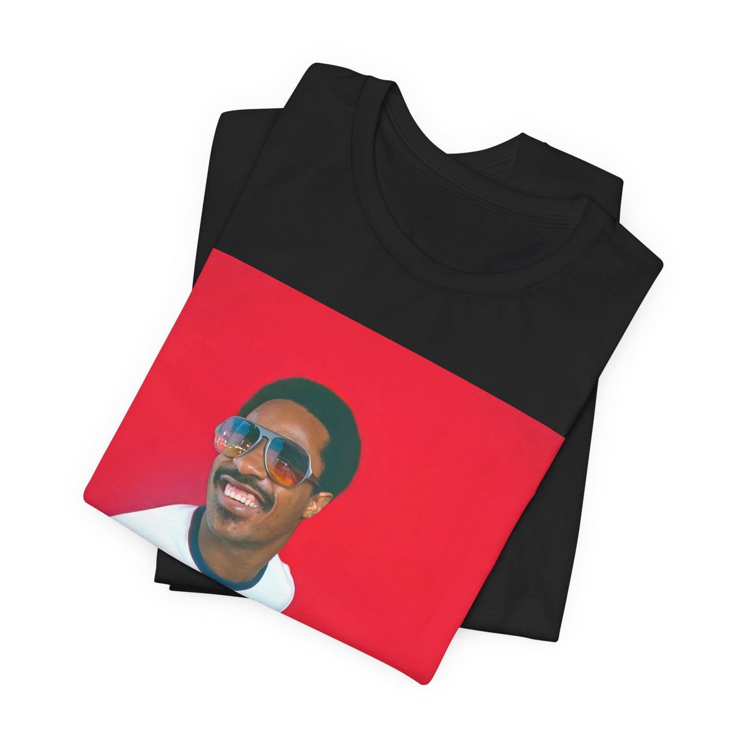A black graphic t-shirt featuring a graphic of Stevie Wonder with a piano.