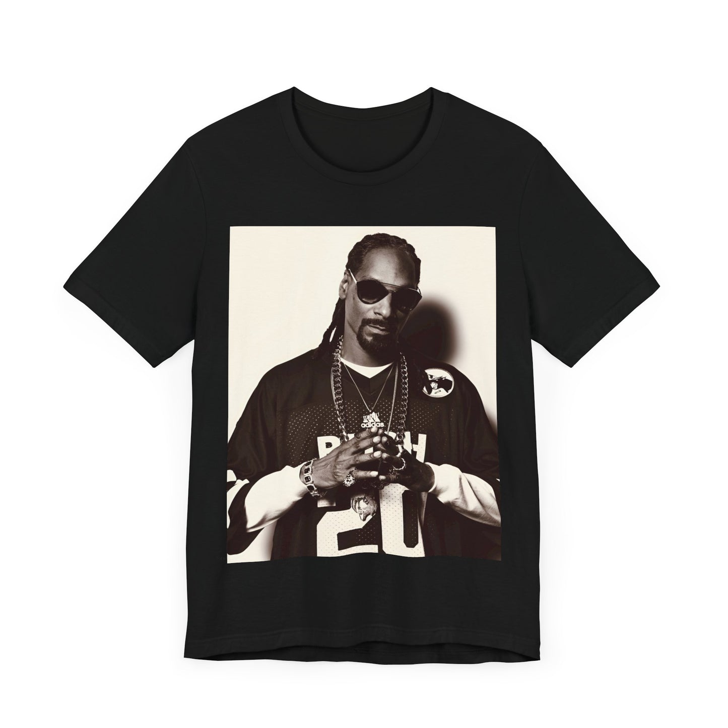 A black graphic t-shirt featuring a black and white, monochrome graphic or photo of Snoop Dogg in an OG style.