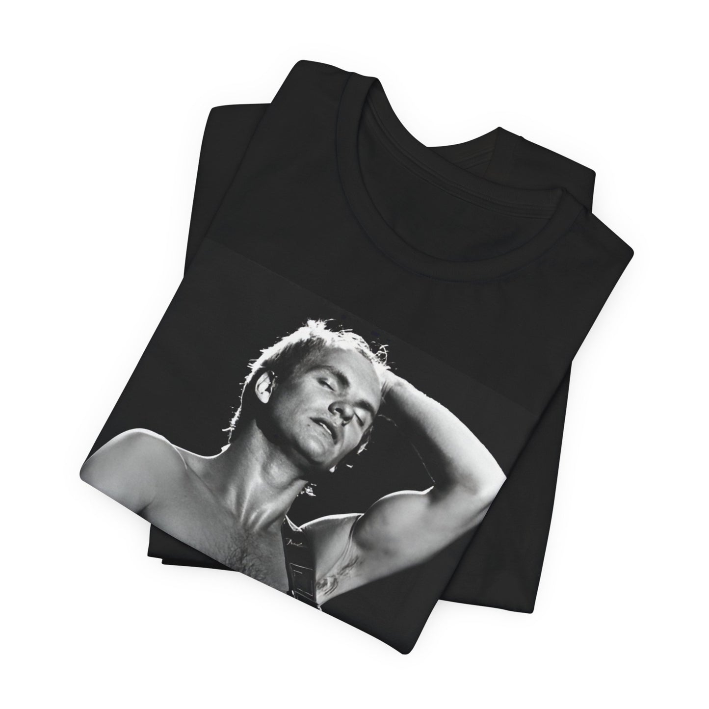 A black graphic t-shirt featuring a graphic or photo of Sting performing live on stage in 1983.