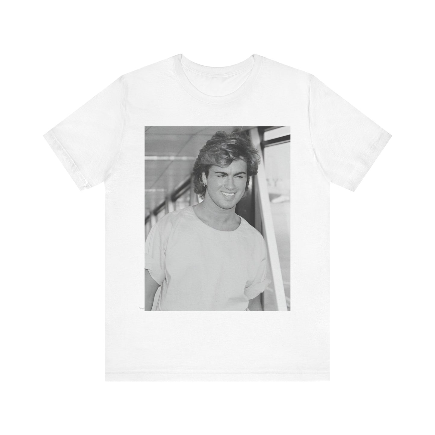 A black graphic t-shirt featuring an 80s black and white vintage photo or graphic of George Michael.