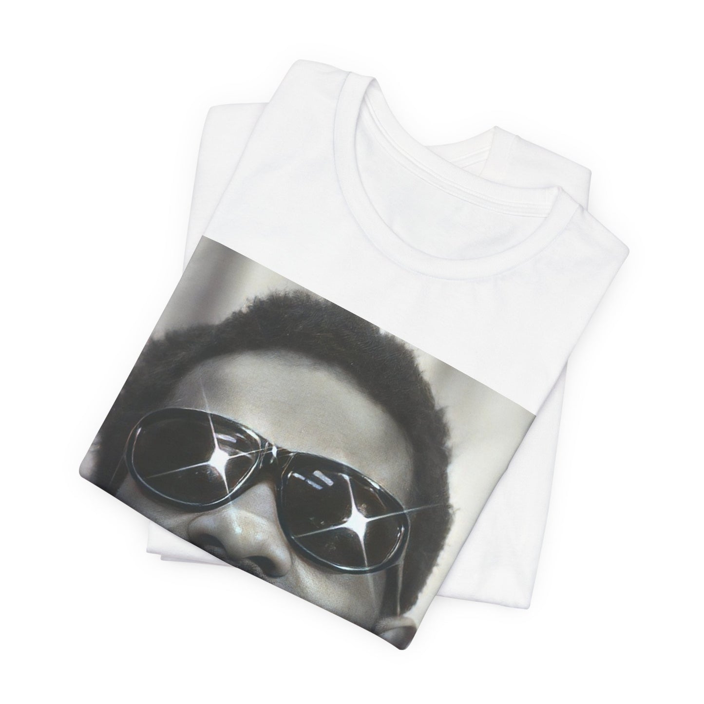 A black graphic t-shirt featuring a 70s funk aesthetic black and white graphic or photo of Stevie Wonder.