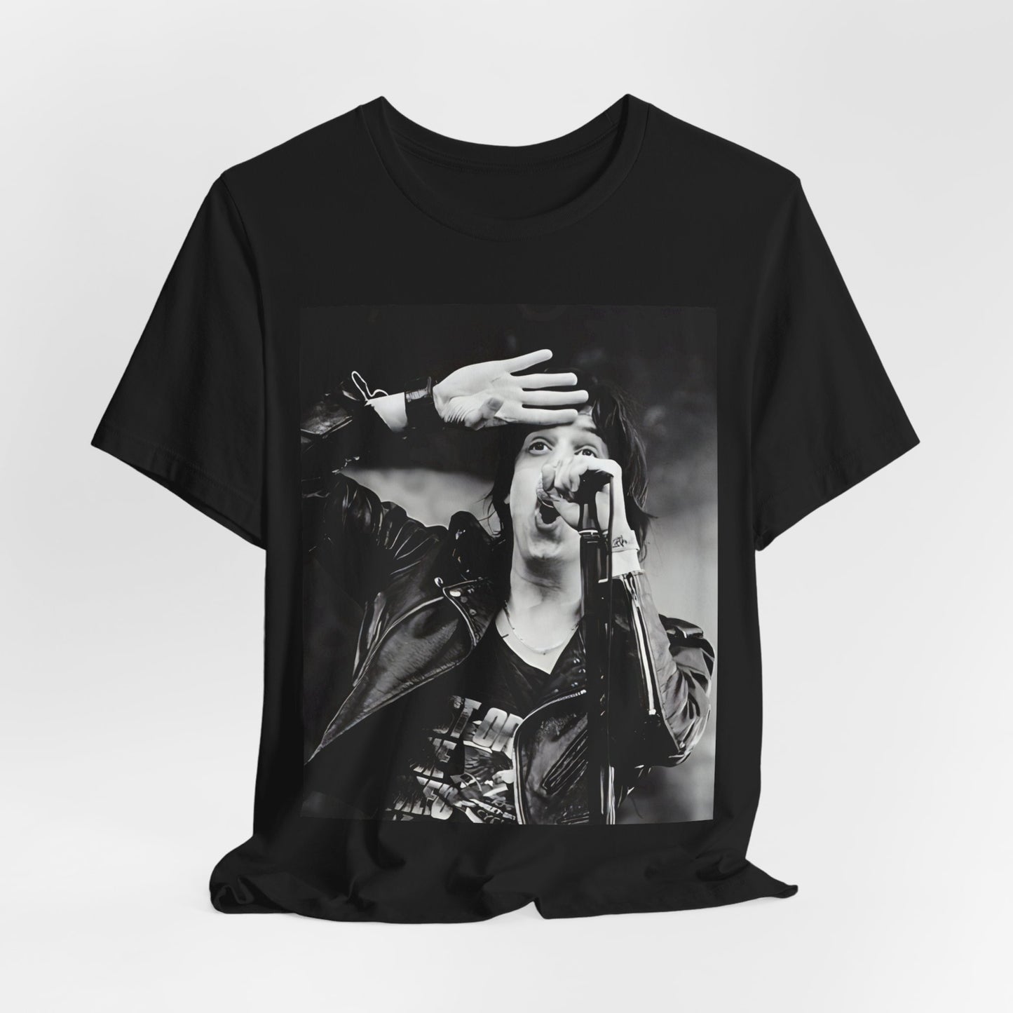 A black graphic t-shirt featuring a black and white portrait photo of The Strokes band.