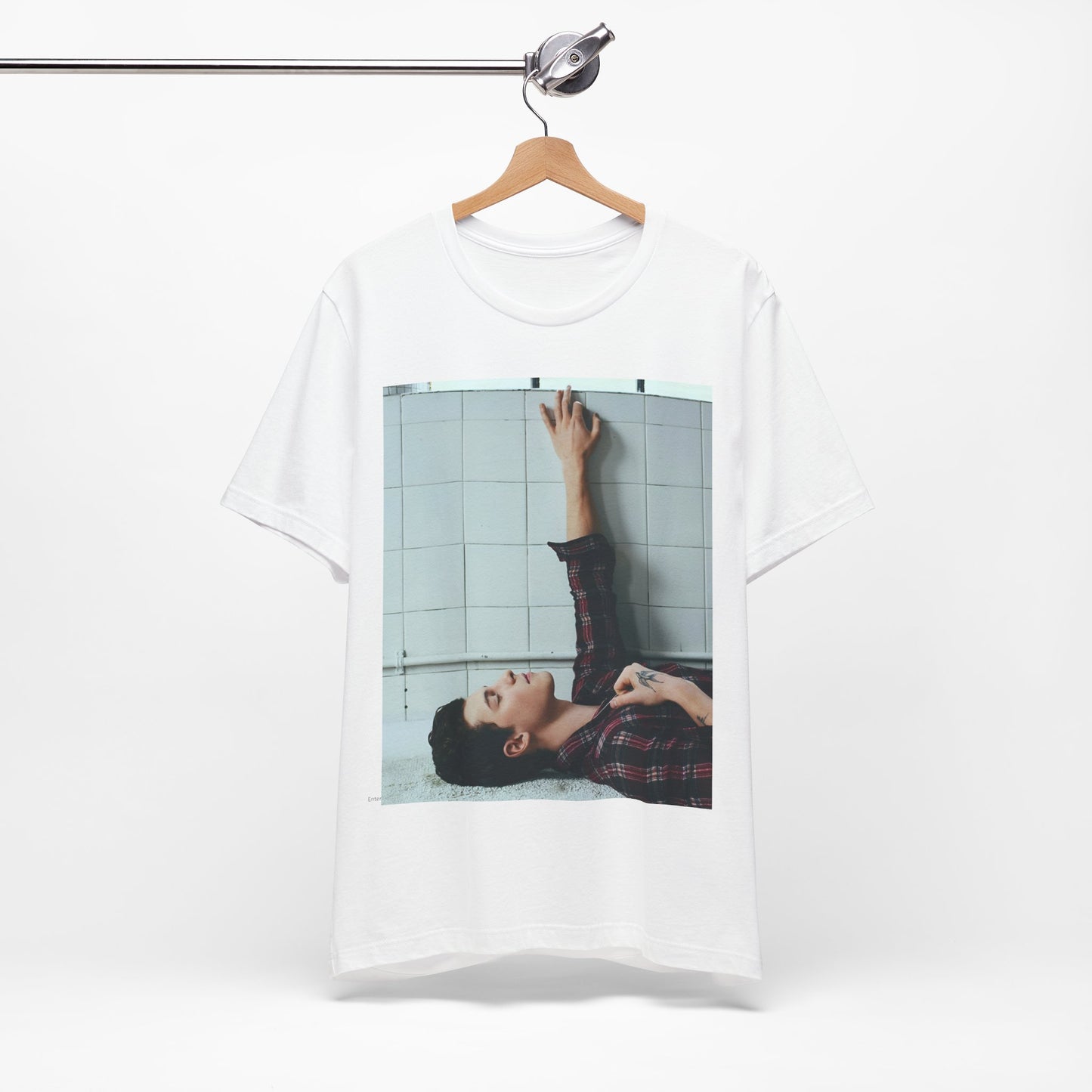 A black graphic t-shirt featuring a bold graphic of Shawn Mendes as a superstar.