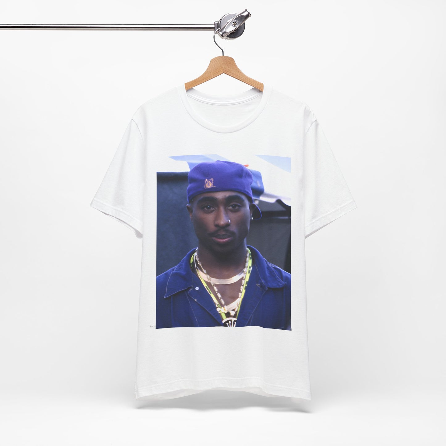 A black graphic t-shirt featuring a graphic related to Tupac's 'California Love' song or era.