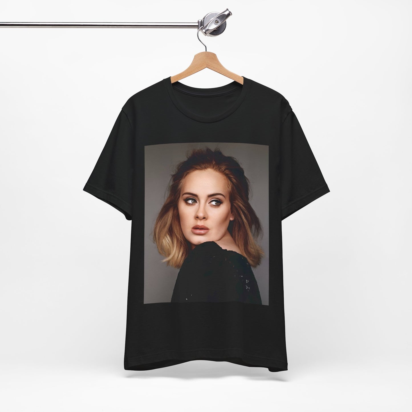 A black graphic t-shirt featuring a studio portrait of Adele from her '25' album era, showing a thoughtful or serene expression.