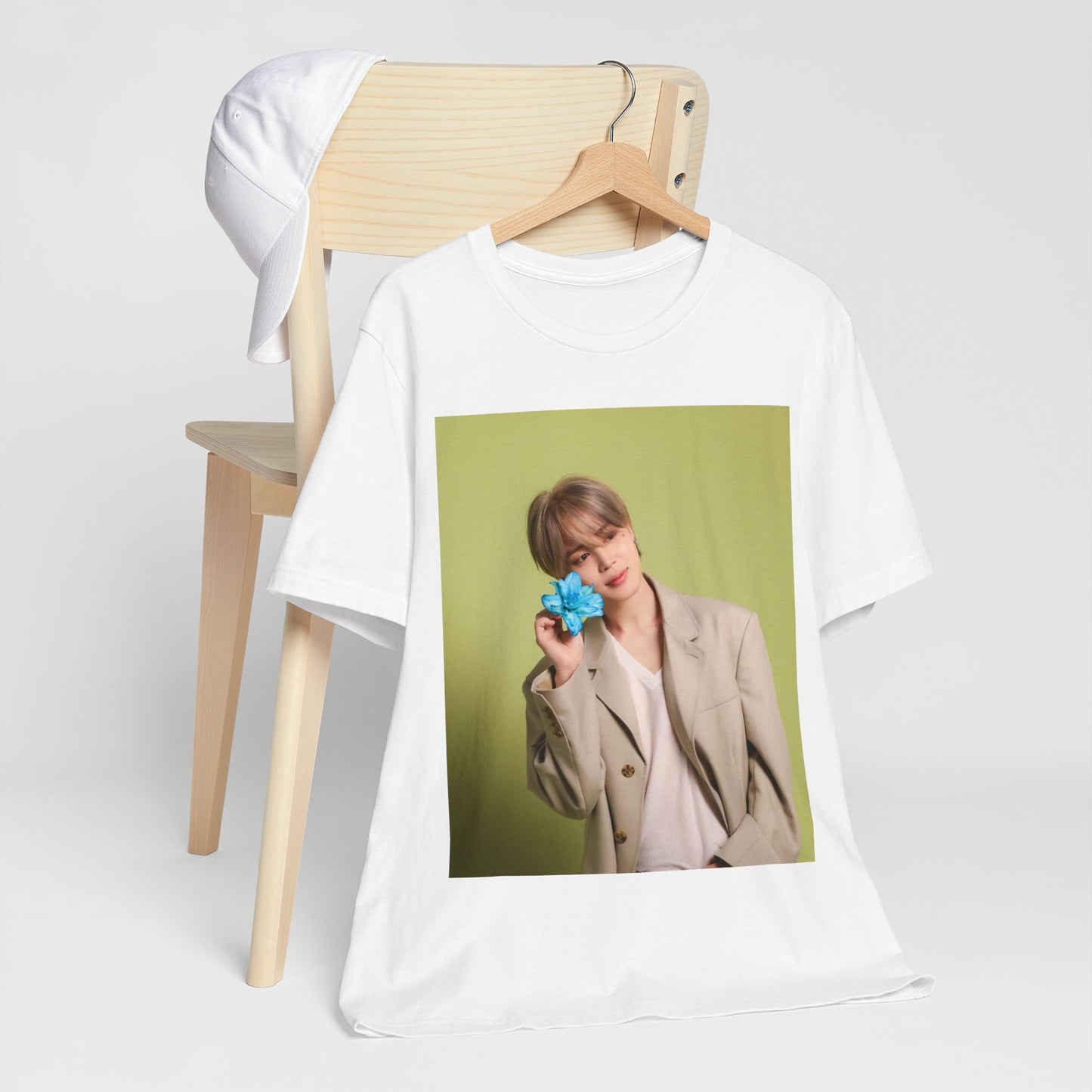 A black graphic t-shirt featuring a vintage K-Pop aesthetic graphic of Jimin.