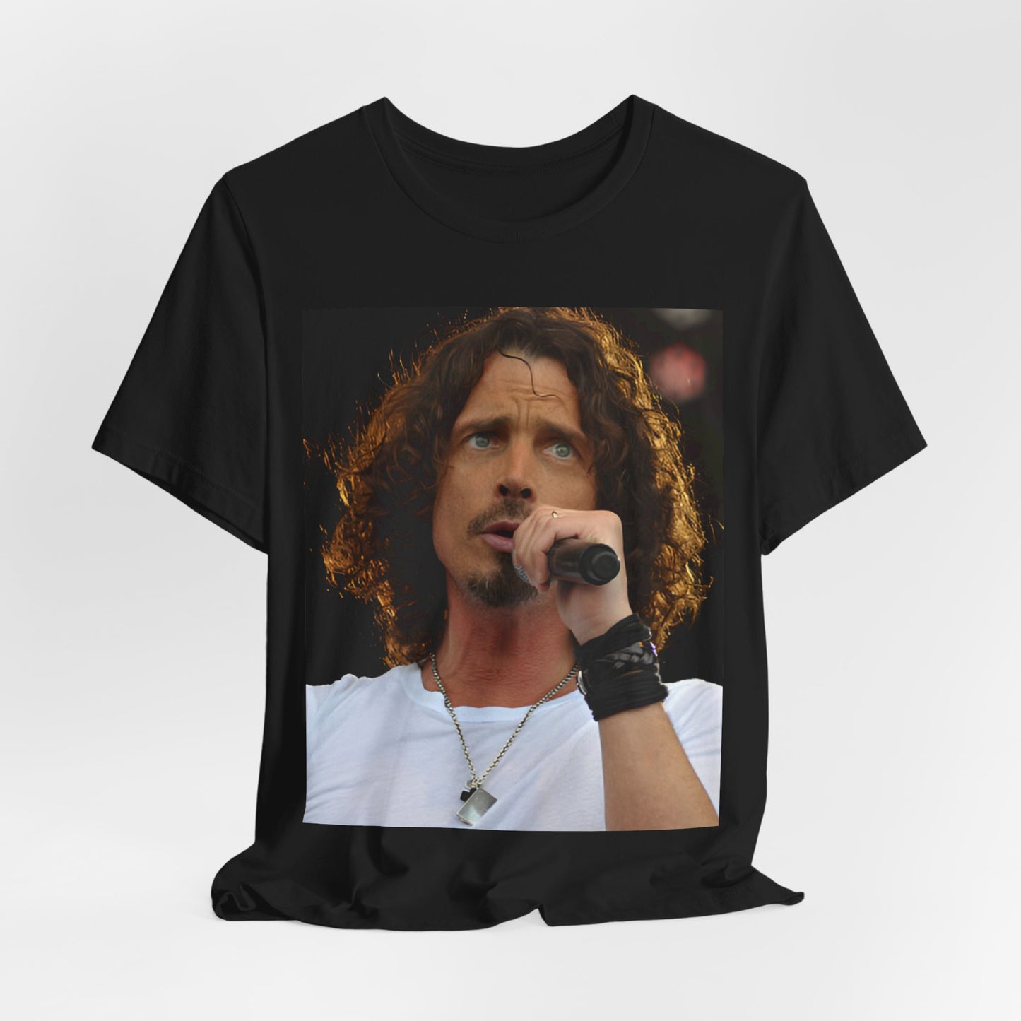 A black graphic t-shirt featuring a graphic related to Chris Cornell's song 'Like a Stone' or Audioslave.