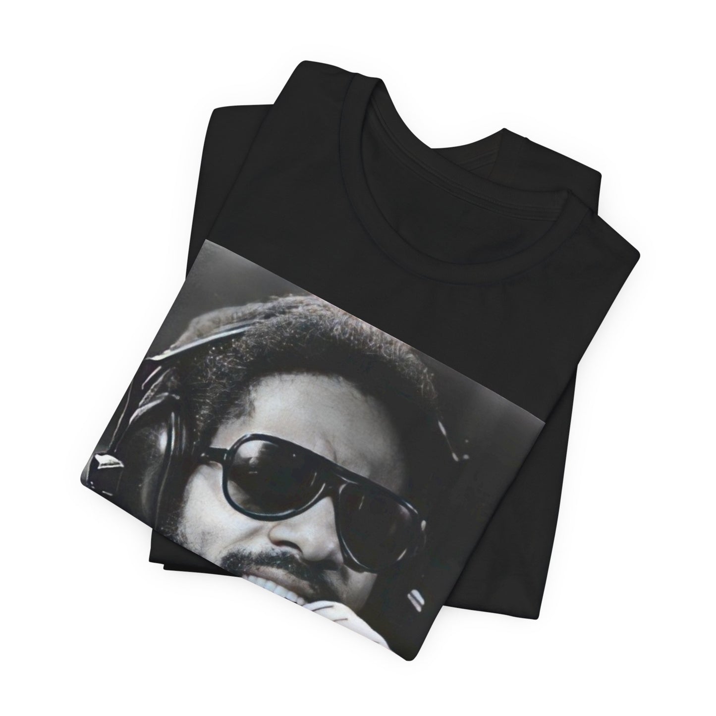 A black graphic t-shirt featuring a graphic of Stevie Wonder as a timeless visionary.