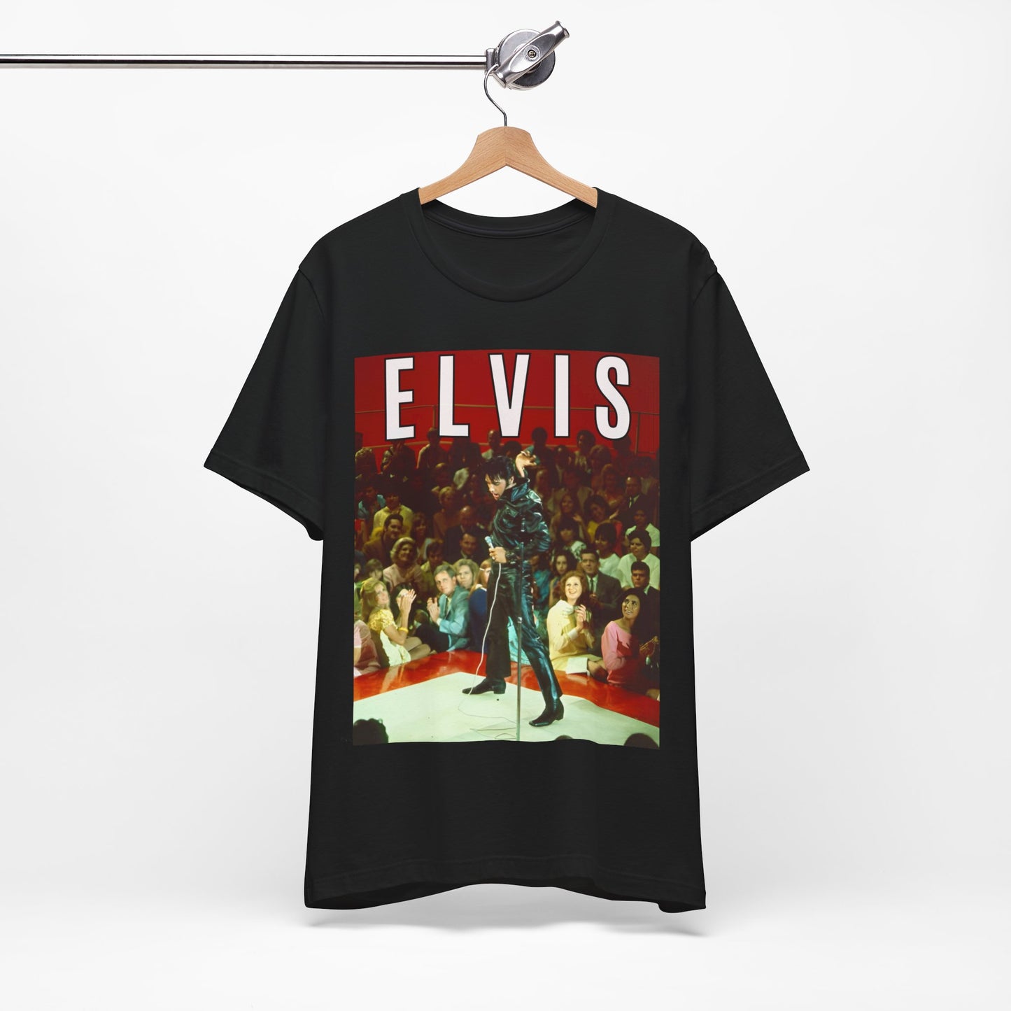 A black graphic t-shirt featuring a retro graphic related to an Elvis Presley special concert.