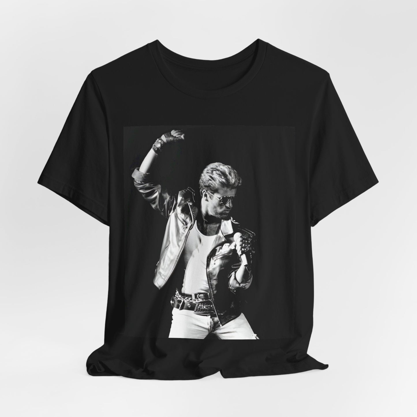 A black graphic t-shirt featuring an iconic black and white portrait photo of George Michael.