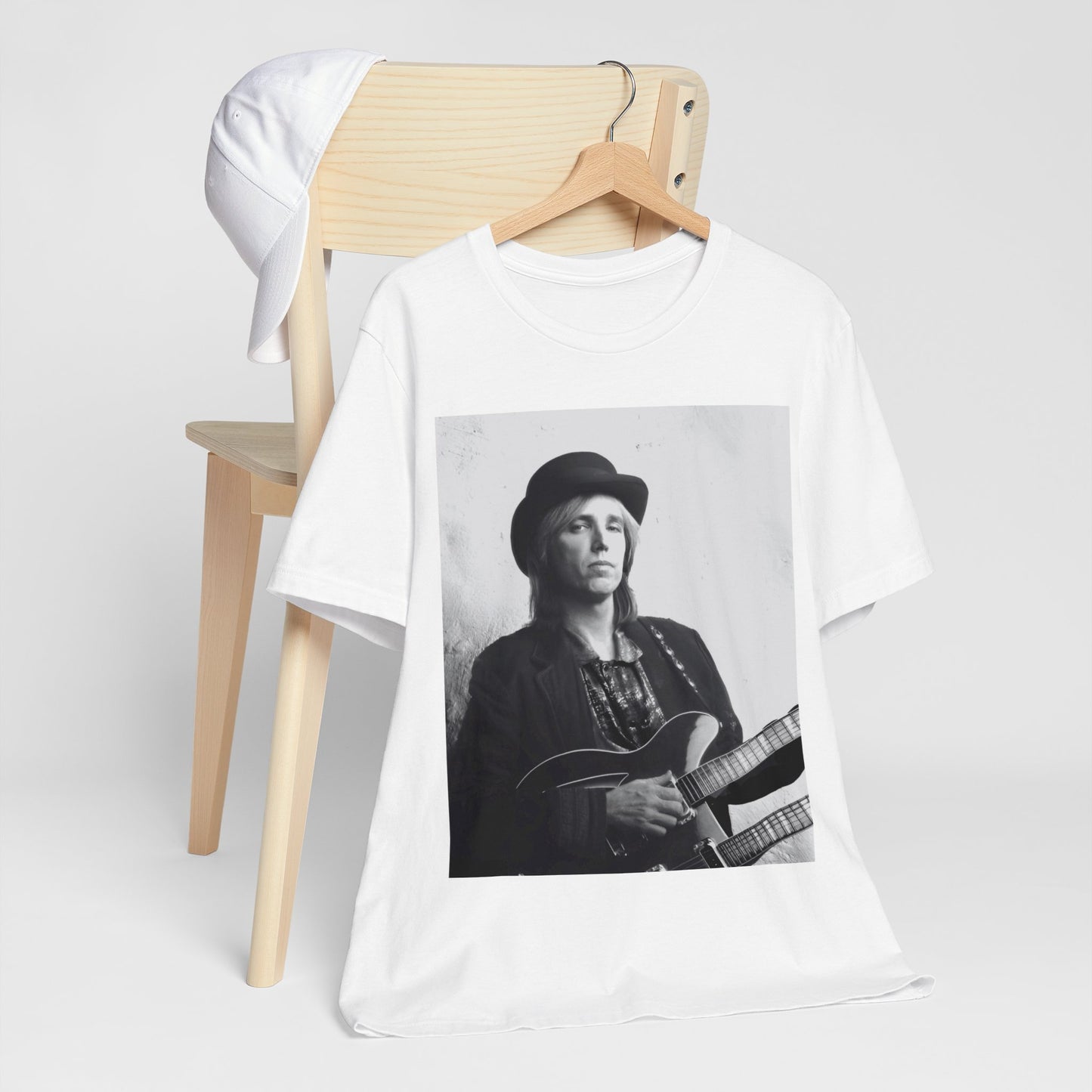 A black graphic t-shirt featuring a graphic related to Tom Petty's 'Wildflowers' album era.