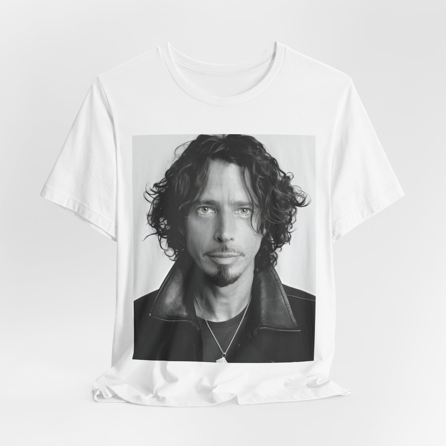 A black graphic t-shirt featuring a timeless black and white photo portrait of Chris Cornell.