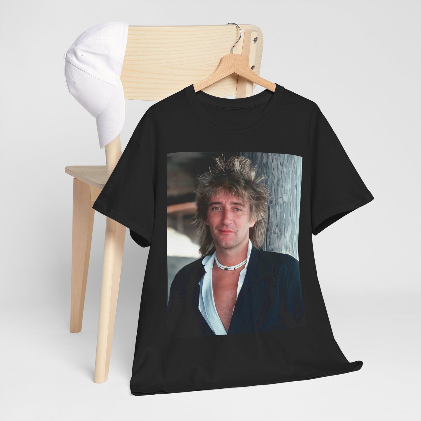 A black graphic t-shirt featuring a graphic of Rod Stewart as a cool British rocker.