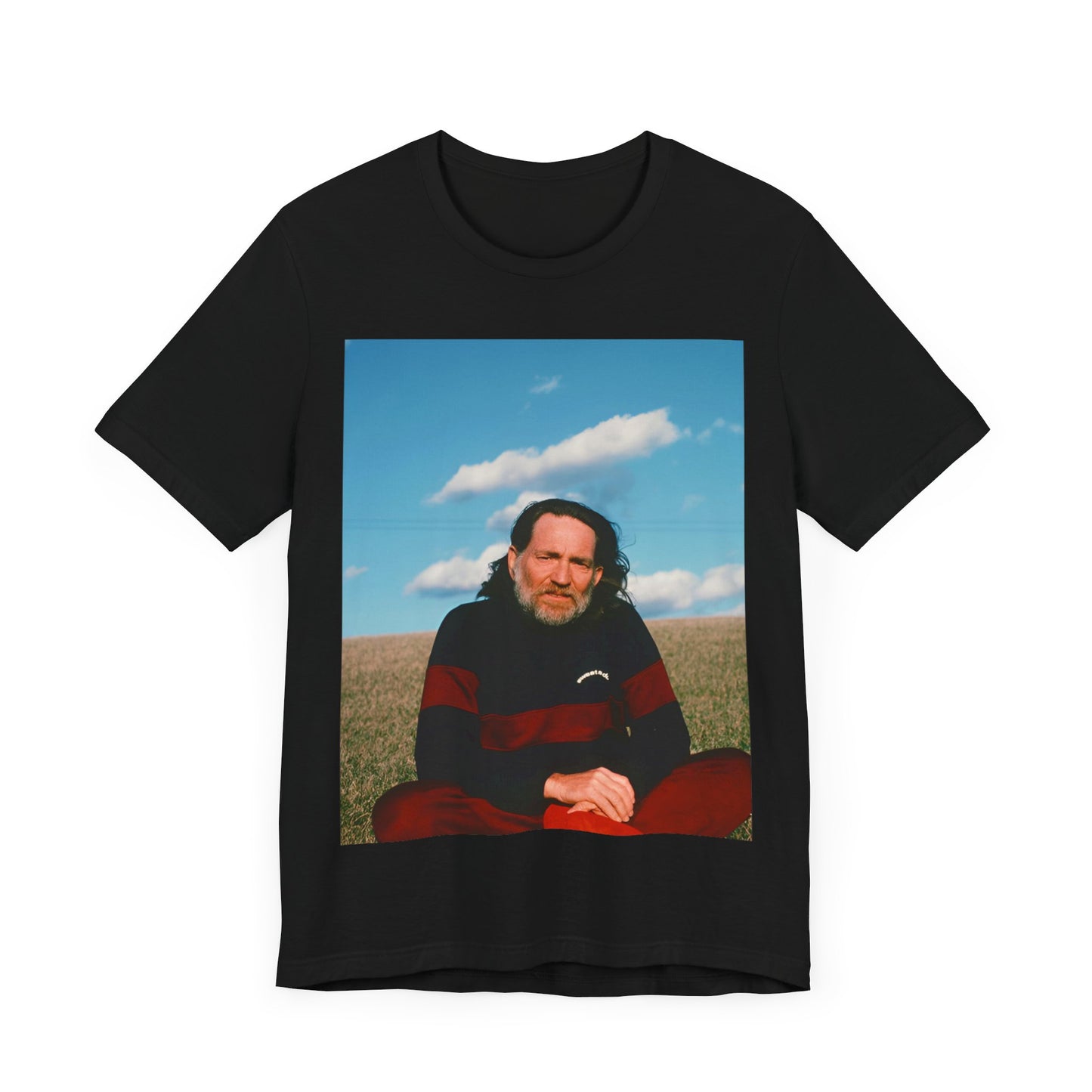 A black graphic t-shirt featuring a classic outlaw country graphic of Willie Nelson.