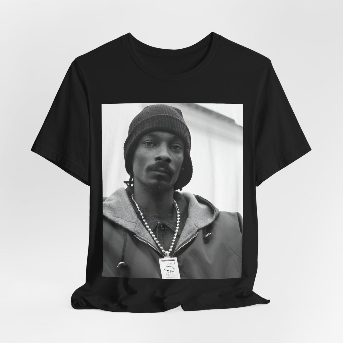 A black graphic t-shirt featuring a black and white, monochrome graphic of Snoop Dogg with an OG cool vibe.