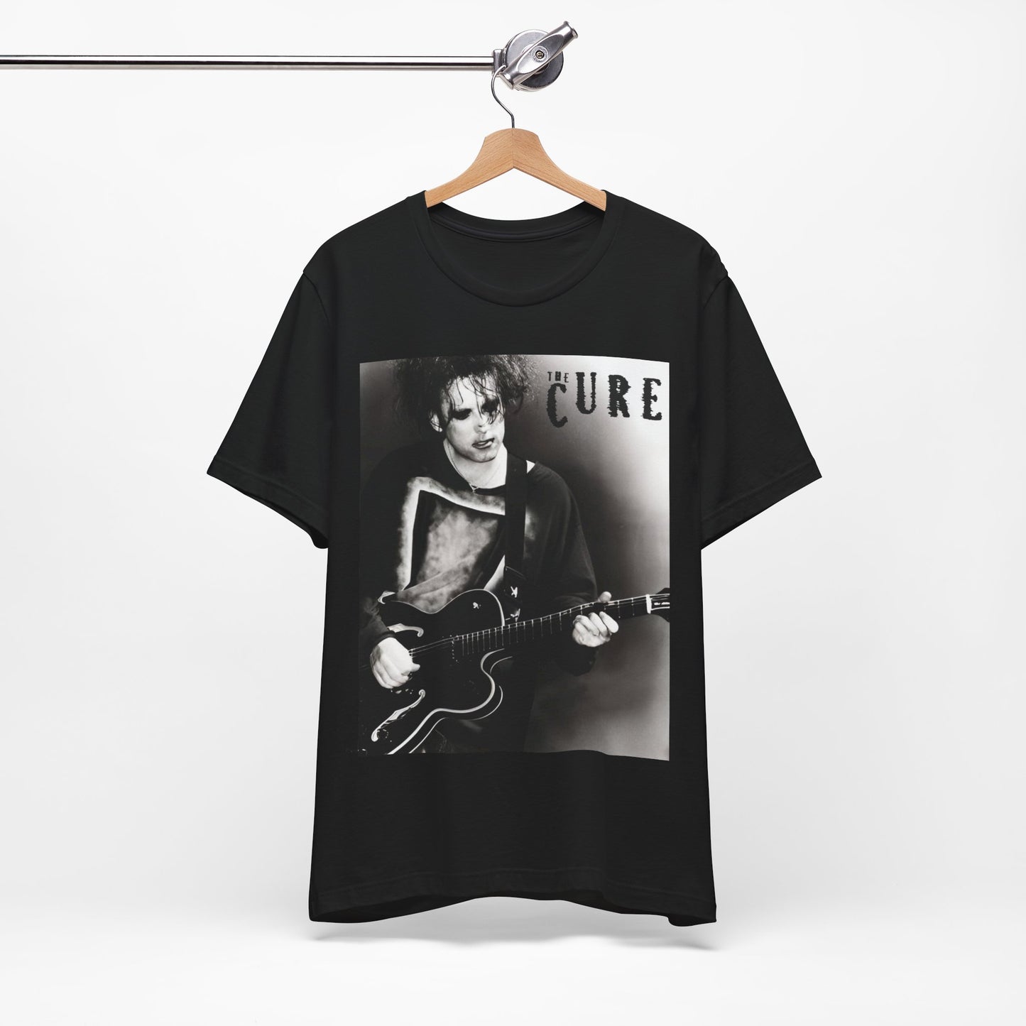 A black graphic t-shirt featuring a vintage goth rock graphic of The Cure.