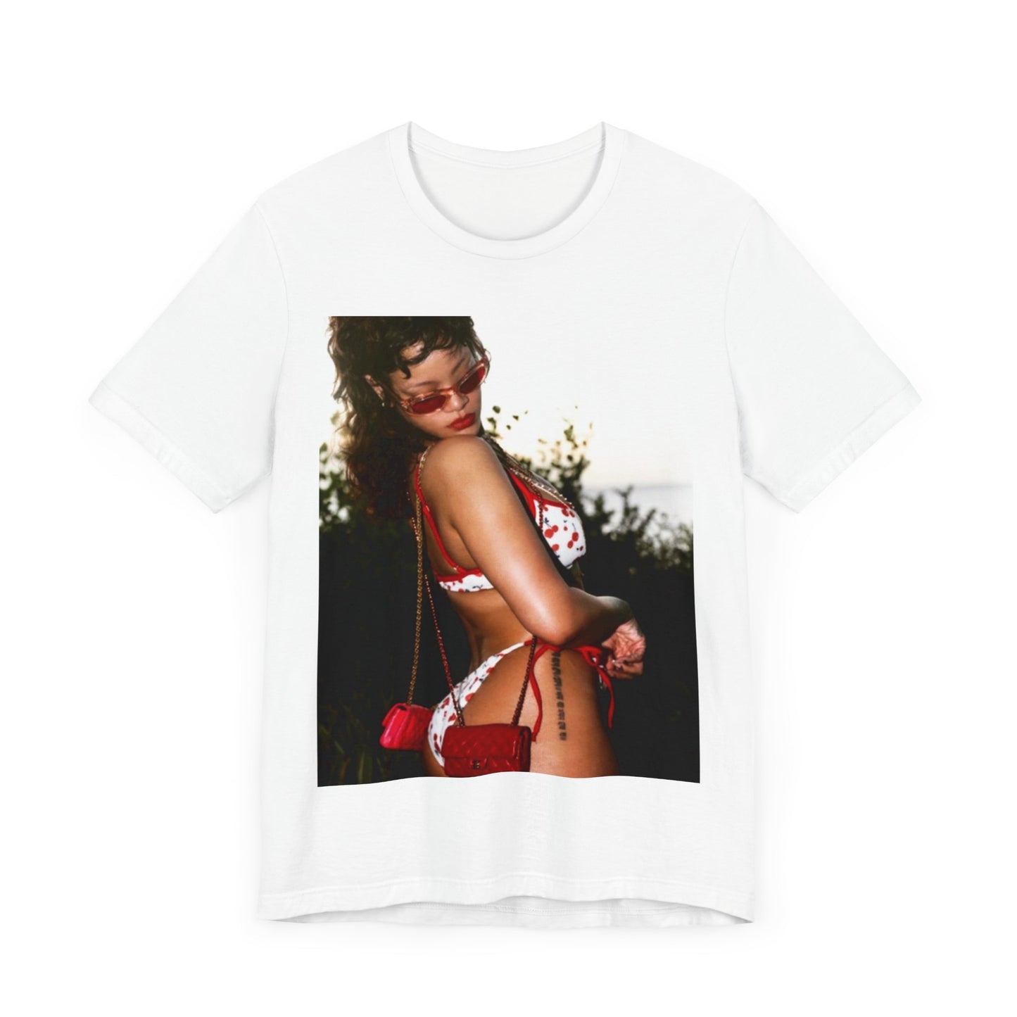 A black graphic t-shirt featuring a photo graphic of Rihanna in a bikini.
