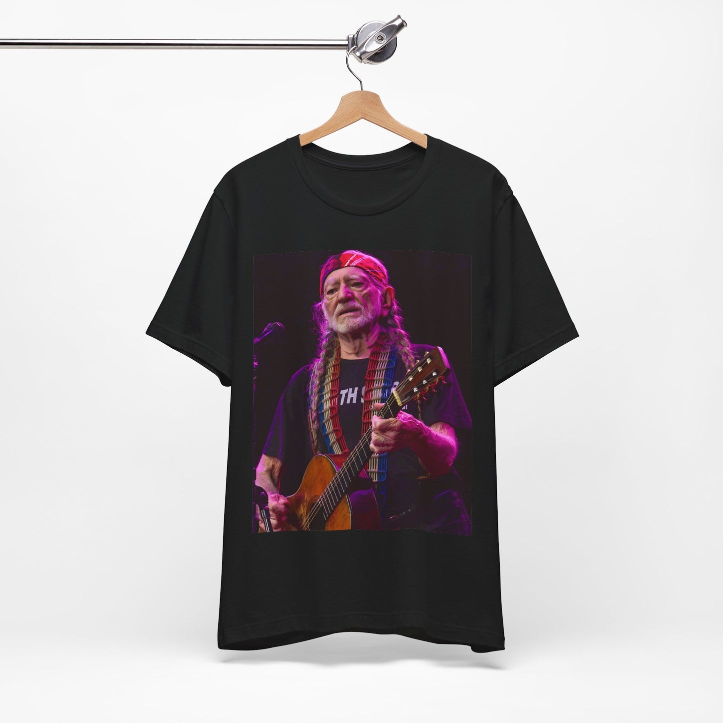 A black graphic t-shirt featuring an outlaw country legend graphic of Willie Nelson.