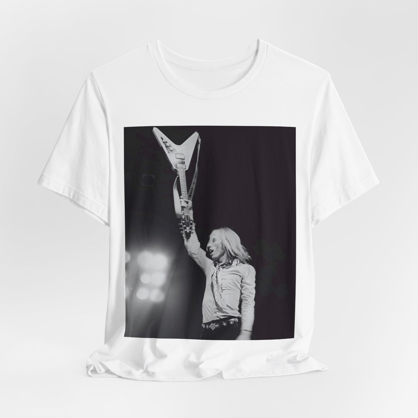 A black graphic t-shirt featuring a graphic or photo of Tom Petty playing guitar on stage.