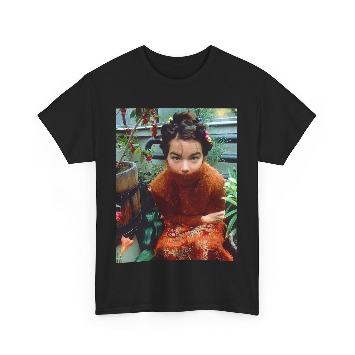 A black graphic t-shirt featuring a dynamic and 'fierce' graphic of Bjork, emphasizing her strong and confident presence.