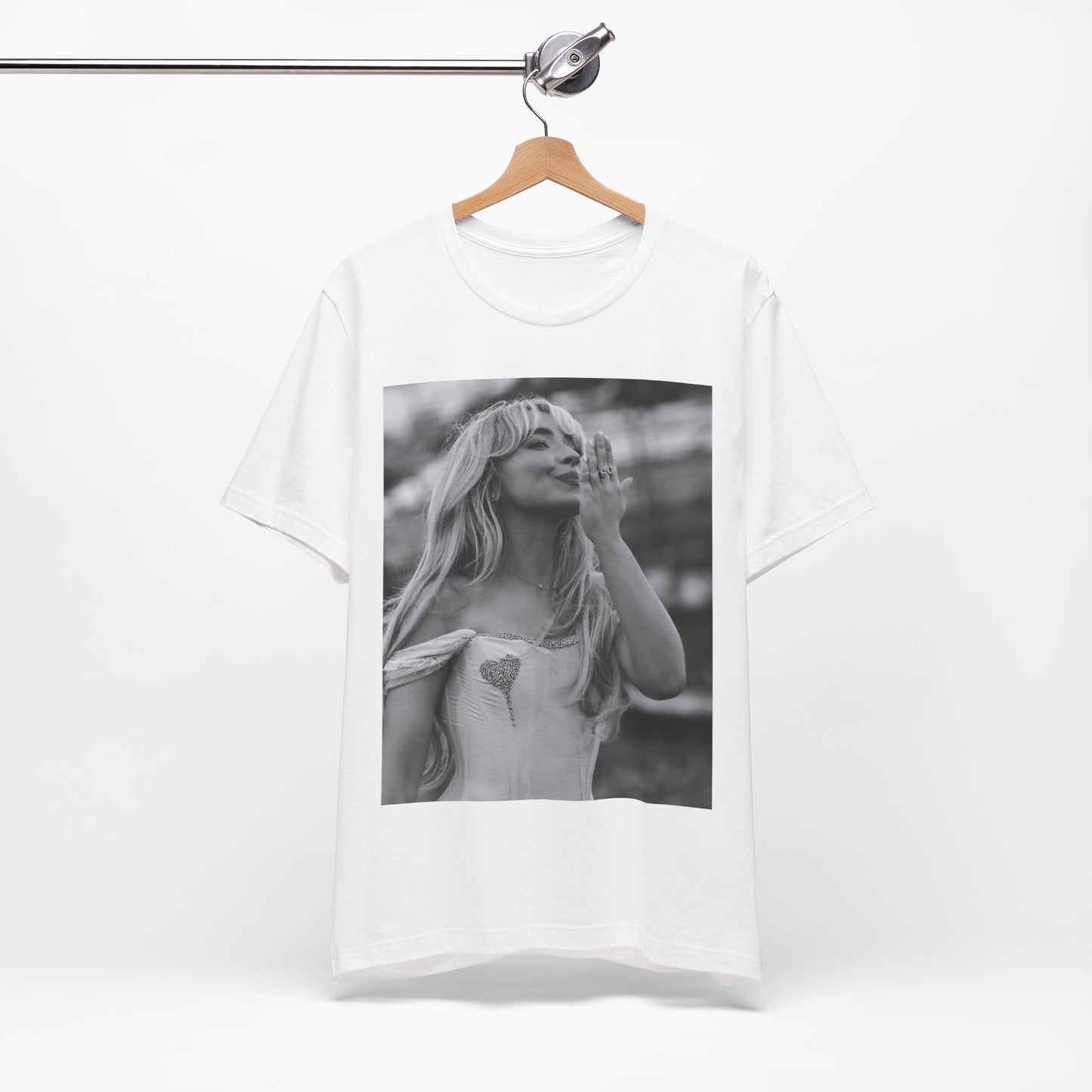 A black graphic t-shirt featuring a graphic or photo of Sabrina Carpenter kissing on stage during a performance.