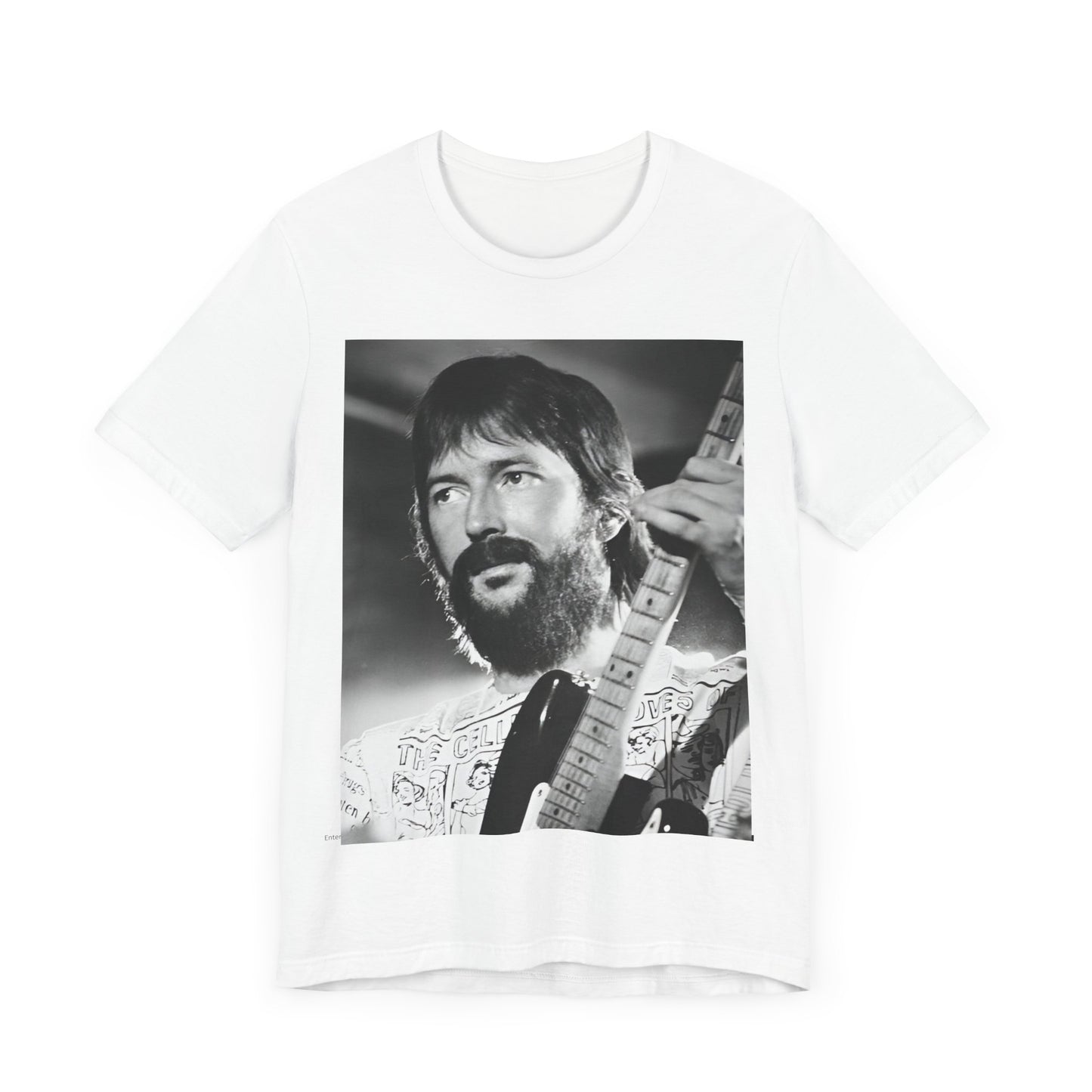 A black graphic t-shirt featuring a graphic of Eric Clapton as an authentic guitar god.