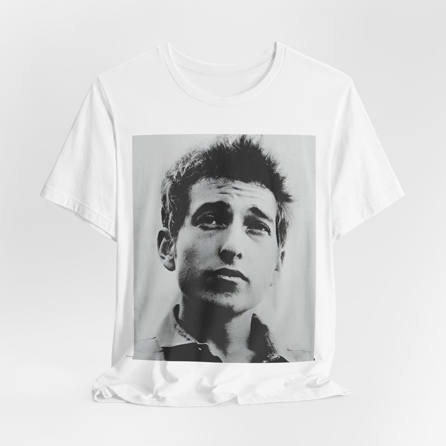 A black graphic t-shirt featuring a retro black and white folk iconic graphic of Bob Dylan.