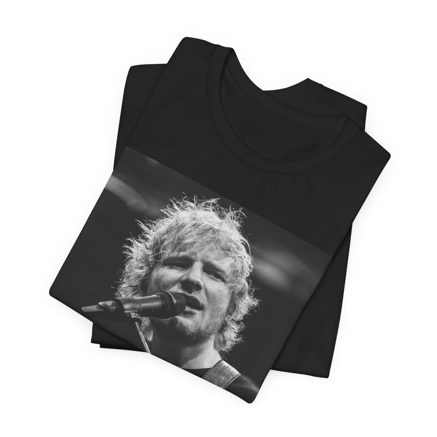 A black graphic t-shirt featuring a black and white photo of Ed Sheeran performing live.