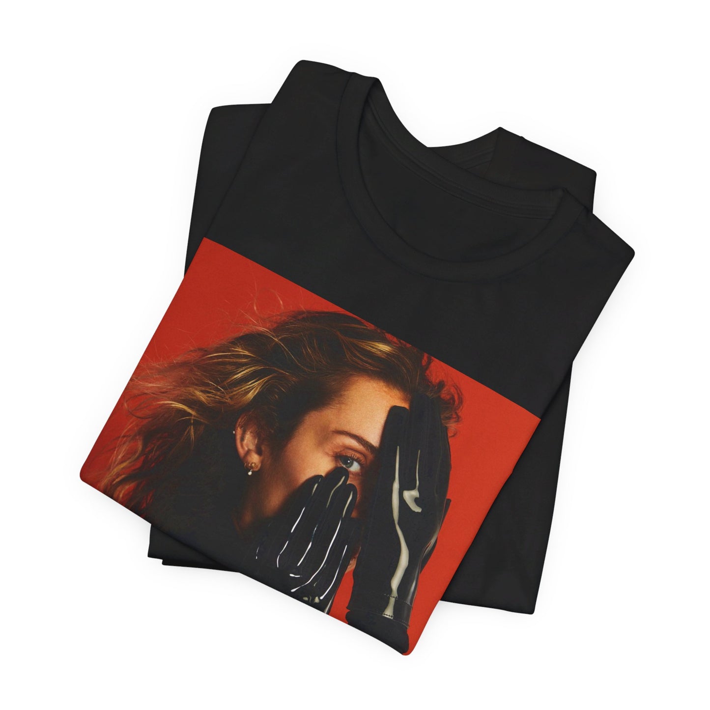 A black graphic t-shirt featuring a graphic of Miley Cyrus with Nashville or country music elements.