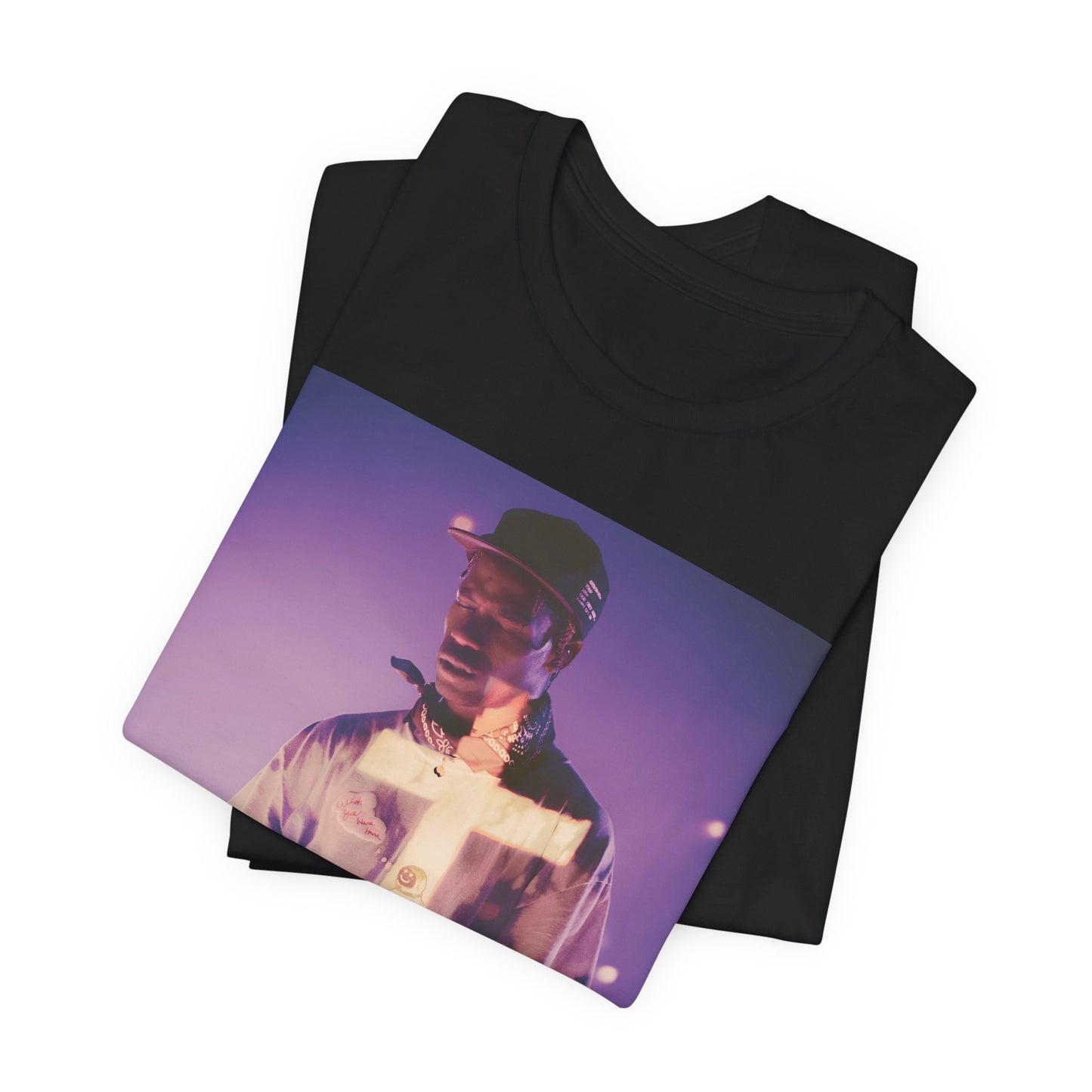 A black graphic t-shirt featuring a graphic of Travis Scott with dark fantasy vibes.