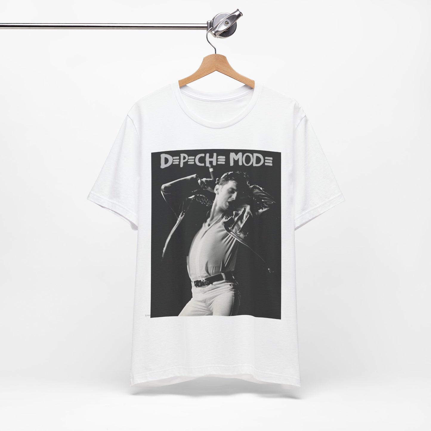 A black graphic t-shirt featuring a black and white graphic or photo of Depeche Mode performing live on stage.