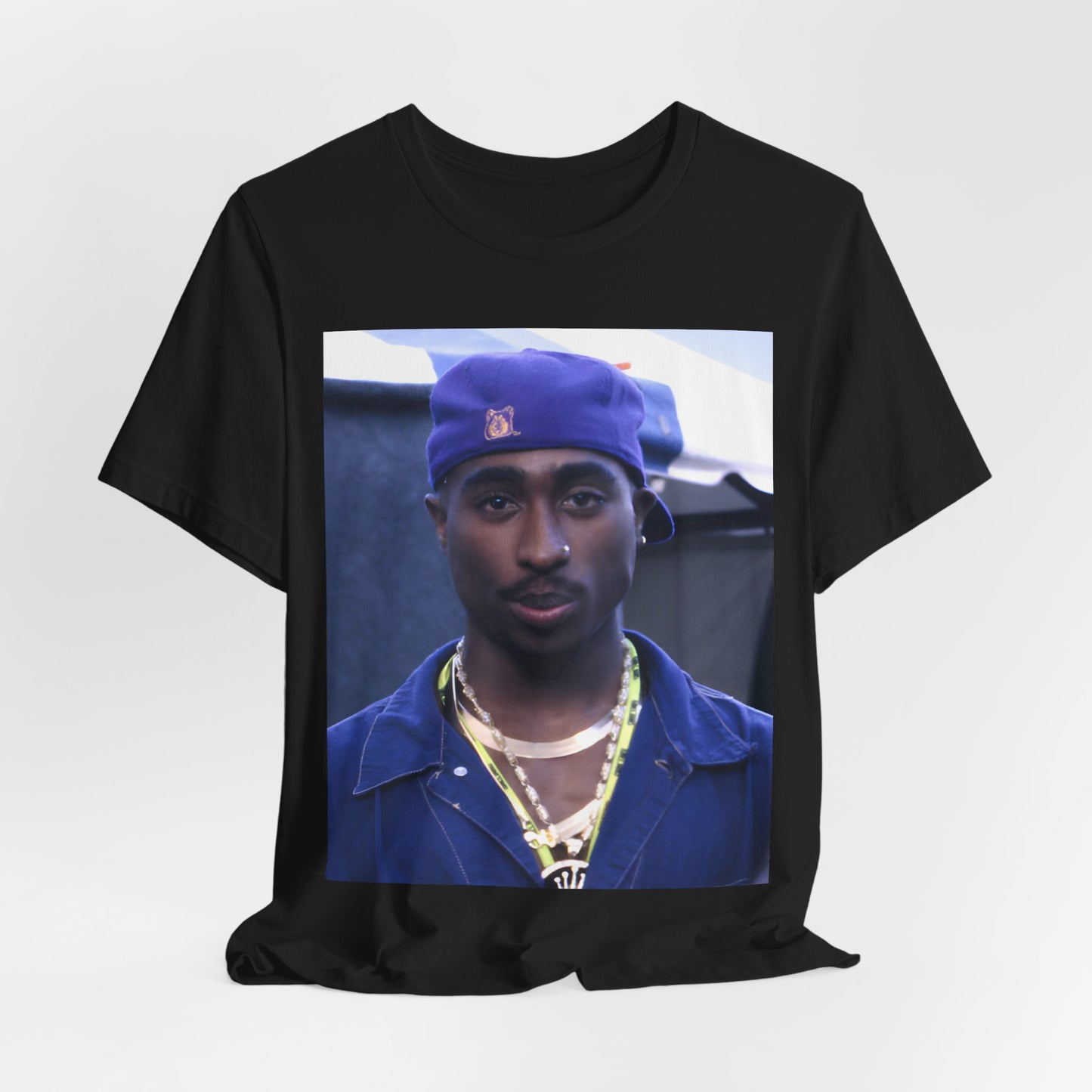 A black graphic t-shirt featuring a graphic related to Tupac's 'California Love' song or era.