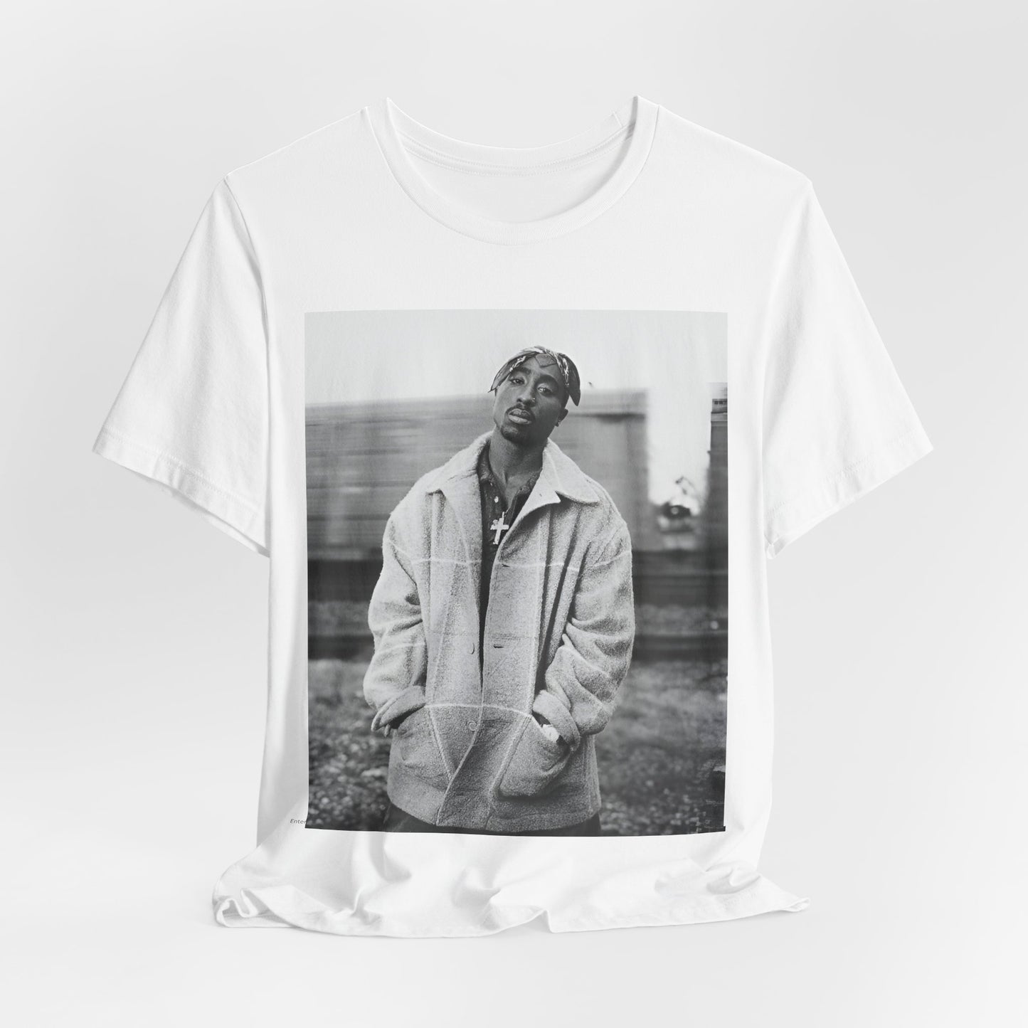 A black graphic t-shirt featuring a graphic related to Tupac's 'Thug Life' philosophy.